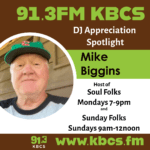 brown green white profile image with pic of Mike Biggins and info